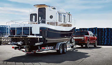 2022 Nissan TITAN Truck towing boat | Greenway Nissan of Florence in Florence AL